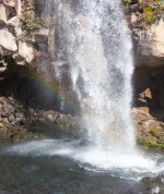 Rainbow splash at Taranaki Falls